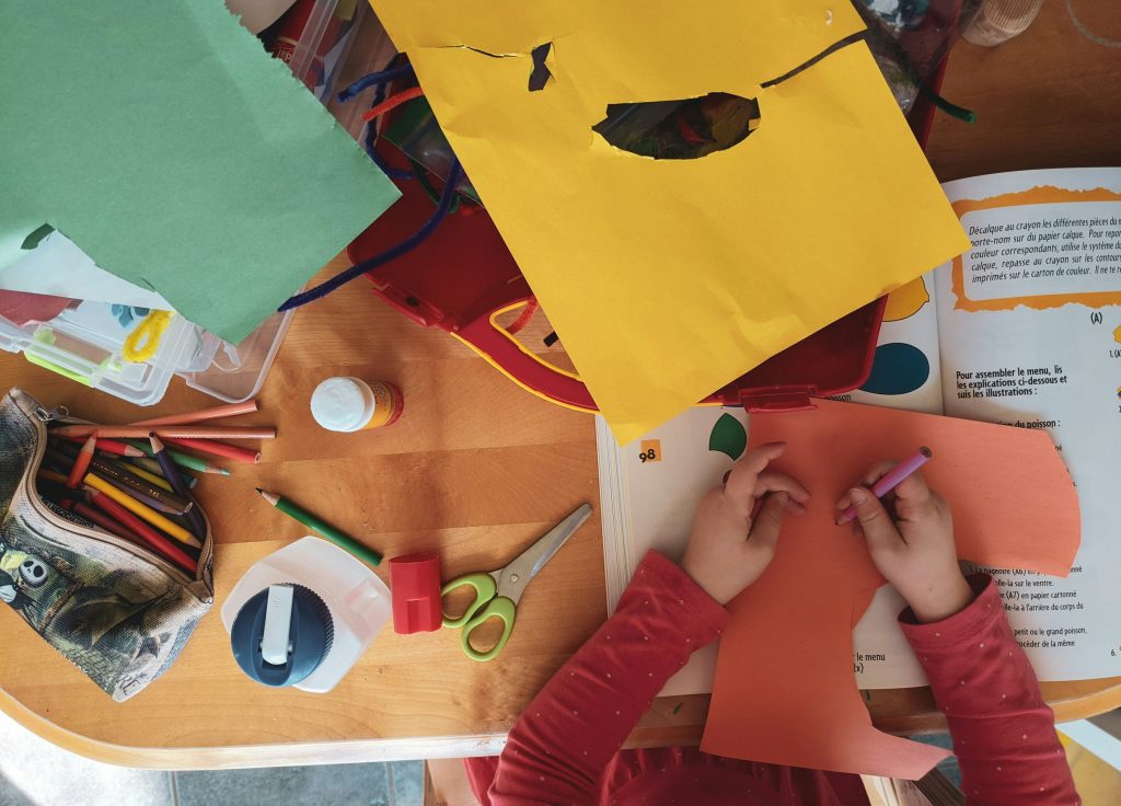Image of a child playing with arts and crafts.
